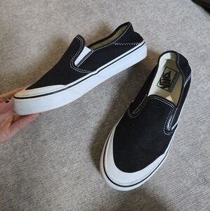 Vans Unisex Women's / Men's Slip-On Half Moon Black and White Slip-On Sneakers